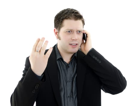Portrait of a handsome young business man talking on mobile phone. Isolated on white background with copy space.