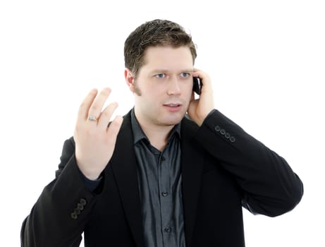 Portrait of a handsome young business man talking on mobile phone. Isolated on white background with copy space.