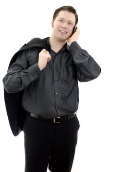 Portrait of a handsome smiling young business man talking on mobile phone. Isolated on white background with copy space.