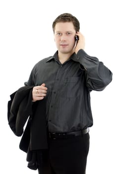 Portrait of a handsome young business man talking on mobile phone. Isolated on white background with copy space.