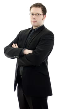 Portrait of a handsome young business man in glasses with arms crossed. Isolated on white background with copy space.