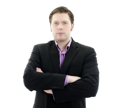 Portrait of a handsome young business man with arms crossed. Isolated on white background with copy space.