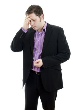 Portrait of a young business man looking depressed from work. Isolated over white background