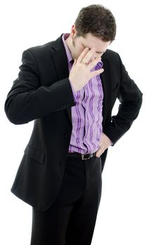 Portrait of a young business man looking depressed from work. Isolated over white background