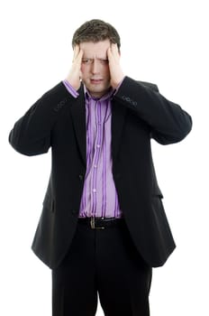 Portrait of a young business man looking depressed from work. Isolated over white background