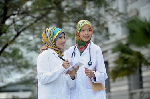 Two Women Doctor With Scarf, Outdoor