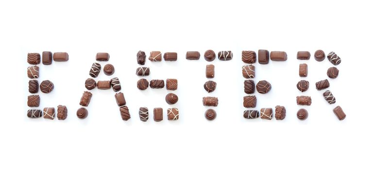 The word easter formed using chocolates over a white background