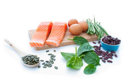 Protein rich foods including eggs, spinach leaves and kidney beans