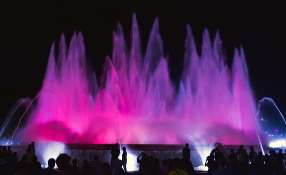 People silhouette of fountain on Placa De Espanya in Barcelona, Spain