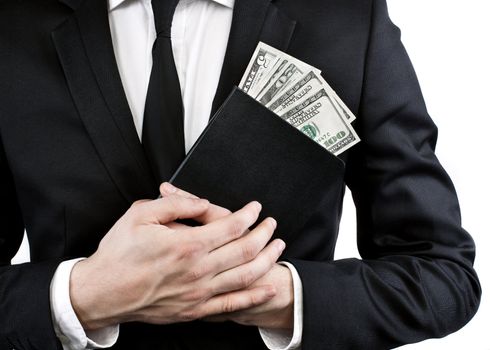 notebook and money in the hands of a man in a jacket and tie