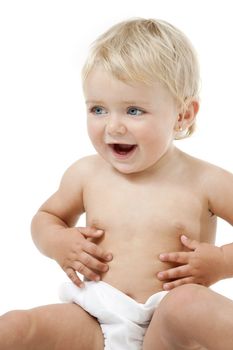 Blue eyed baby girl with hands on her belly. Isolated on white background.