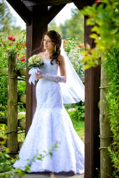 Bride with bouquet outdoors