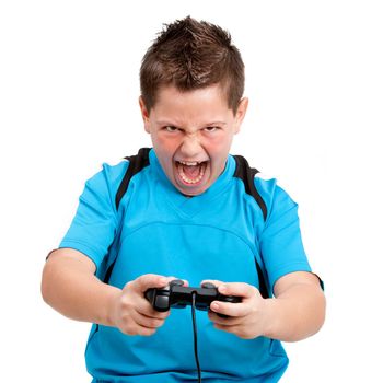 Boy shouting and showing winning attitude while playing with video console. Isolated on white. 