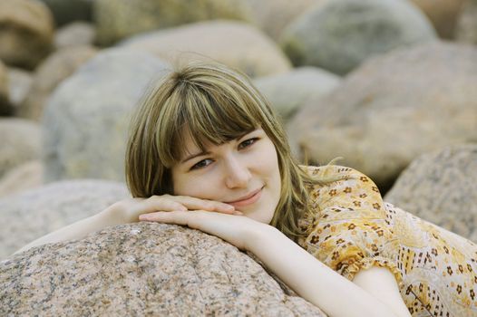 Portrait relax young woman on the big stouns background