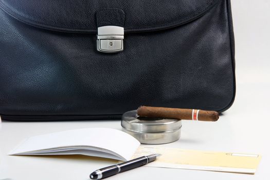 financial deal check writing cigar with black leather briefcase background praspective business concepts