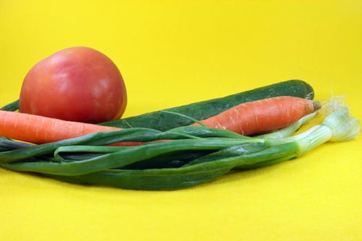 fresh vegetables in yellow background food and agriculture concepts