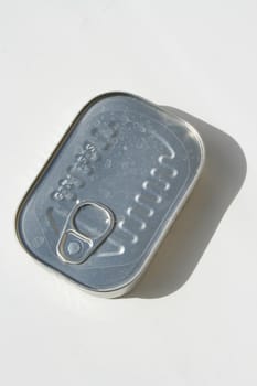 Close up of a tin can with sardines.
