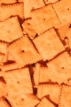 Close up of orange cheese crackers.
