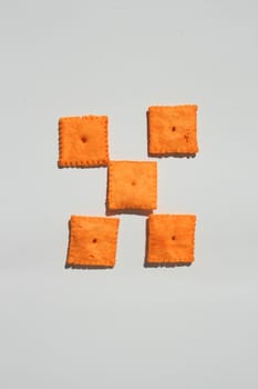 Close up of orange cheese crackers.
