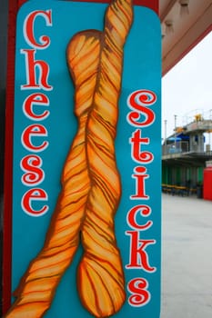 Close up of a cheese sticks sign.
