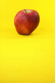 red apple in yellow background food and fruits