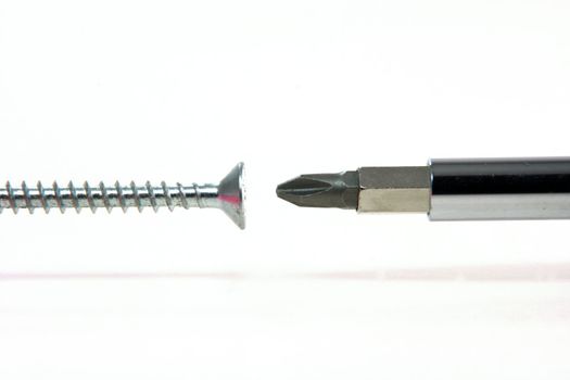 harware tools screw and screwdriver in white background