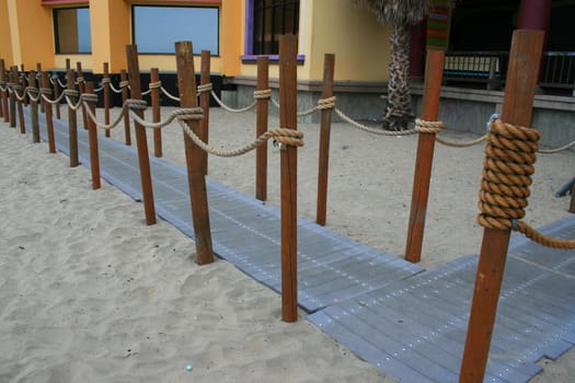 Close up of a decorative pathway on a beach.
