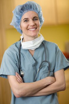 Portrait of smiling woman doctor in surgical scrubs
