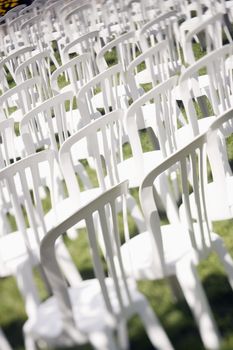 White plastic chairs set for an outdoor event