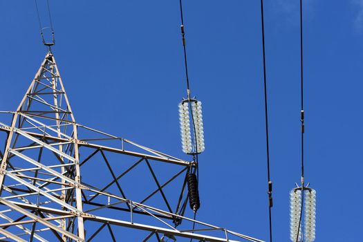 detail from electric pillar and cables in total blue sky