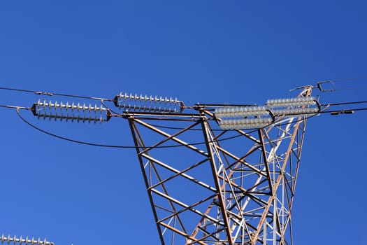 detail from  electric pillar cables in total blue sky