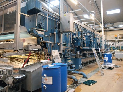 Machinery conveyor belt in a modern factory plant   