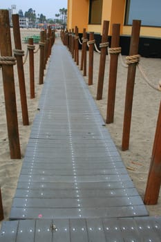 Close up of a decorative pathway on a beach.
