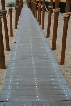 Close up of a decorative pathway on a beach.
