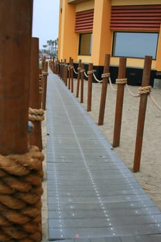 Close up of a decorative pathway on a beach.
