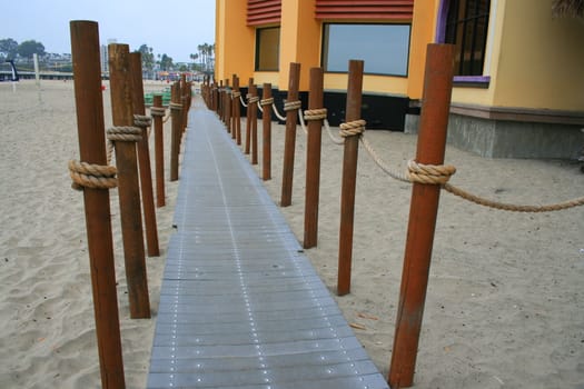 Close up of a decorative pathway on a beach.
