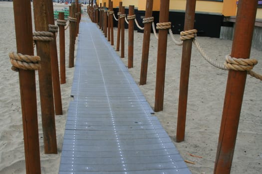 Close up of a decorative pathway on a beach.
