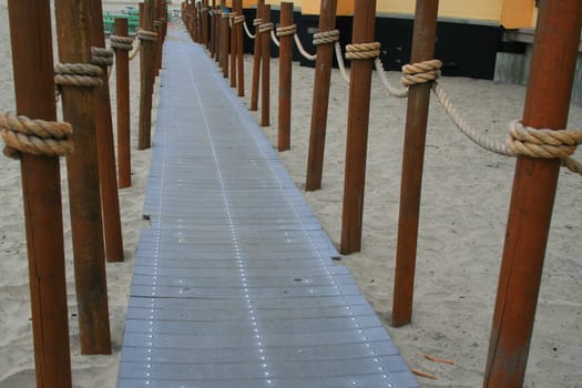 Close up of a decorative pathway on a beach.
