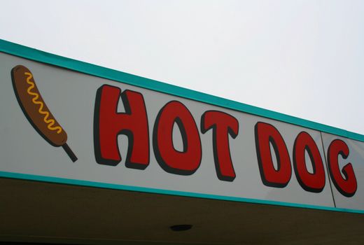 Close up of a hot dog sign.
