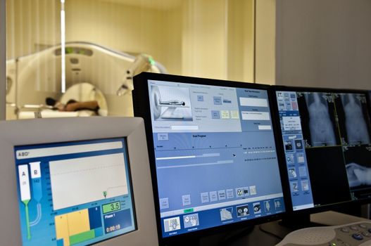 Magnetic resonance scan control room, focus on monitors
