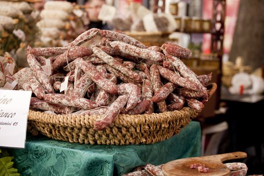 Delicious salame on wicker basket