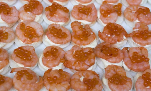 Delicious shrimp canapes on iron tray