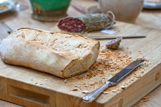 Bread and salame on cutting board
