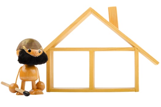 Front view of an isolated wooden house and a toy