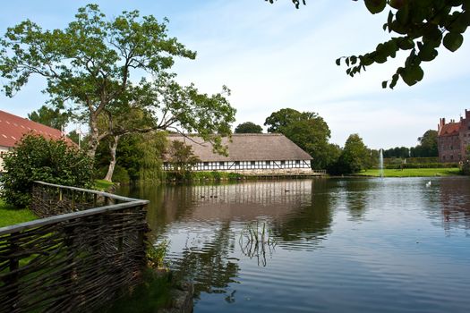 Egeskov castle estate landmark Denmark view from lake side
