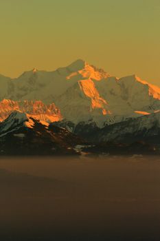 Sunset over the Mont-Blanc, Alps, over the fog