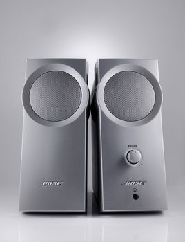 A studio shot of a pair of Bose Speakers