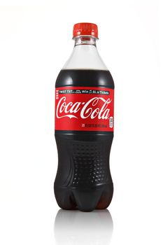 An isolated studio shot of a 20oz bottle of Coca-Cola