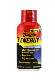 An isolated studio shot of a single shot of Berry flavored 5-hour Energy. 5-hour energy is a liquid energy shot that can help you feel sharp and alert for hours containing a blend of B-vitamins, amino acids, and nutrients. 