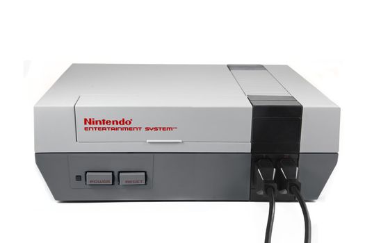 A studio shot on a solid white background of a Nintendo Entertainment System.